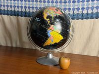 Full view of globe on base showing North and South America