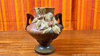 Front view of Roseville Clematis vase showing floral relief and overall form