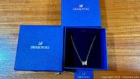Necklace displayed in open Swarovski box