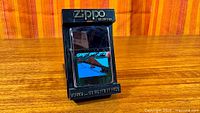 Lighter in original Zippo plastic stand showing front graphic