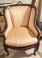 Full front view of upholstered armchair