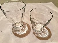 Two tumblers, one large and one small, showing shapes and clarity