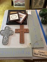 All seven wall décor items arranged on table