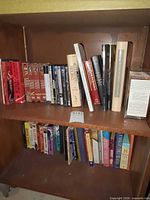 Two shelf view showing books, DVDs, boxed sets