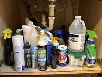 Full lot view under-sink showing majority of cleaning products