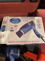 Retail box for IGIA Ion Aire ionizing hair dryer plus view of additional dryers below
