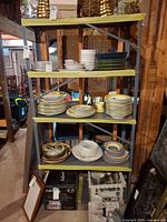 Full view of grey metal shelving unit with five shelves
