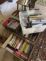 Three boxes with assorted books, overall lot view