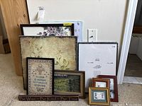 Group shot of all nine items leaning against wall