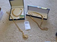 Group shot of all jewelry pieces with cases