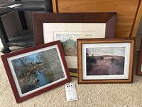 Three framed landscape prints grouped on floor