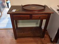 Front view showing entire console table with drawers and lower shelf
