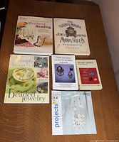 All six books arranged on table