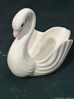 Left side view of ceramic swan figurine dish