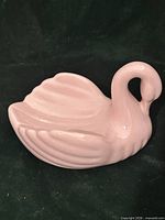 Front view of pink ceramic swan dish