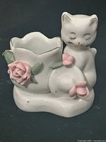 front view cat planter showing floral accents and gold trim