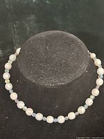 Necklace displayed on bust showing bead design