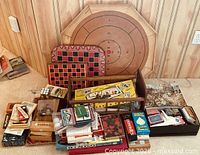 Overall view of all games and puzzles including crokinole board, checkerboard, boxed games and jigsaw