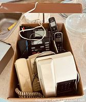 Full box view showing assortment of phones and cords