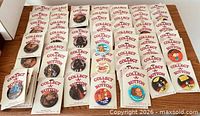 Overall view showing full assortment of Collect-A-Button cards laid out