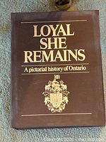 Front of slipcase showing title and crest