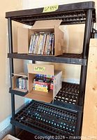 Full view of shelving unit with contents for scale
