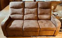 Front view of entire sofa showing three seats and back cushions