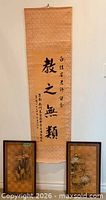 scroll and two framed artworks overall view