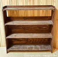front view showing three shelves and gallery top