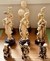 Front view of all nine figurines displaying sizes and bases