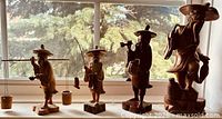 All four wooden figures on windowsill