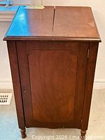 Front view of wood bar cabinet