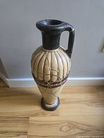 Full view of ceramic amphora showing colors, shape and overall condition