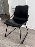 Single chair front view showing seat and sled legs