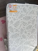 Front view showing tag, leaf pattern cover