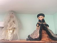 Bridal doll with satin gown and lace veil; Victorian fur-trimmed doll