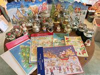 Full table view of snow globes, advent calendars and backdrop