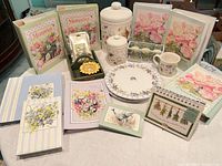 Full lot view showing albums, ceramics, tealight set, wooden caddy, and paper goods