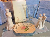 Overall lot view showing both figurines, glass vase, floral plate and Lenox box