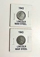 Front view of both 1943 steel pennies in 2×2 holders
