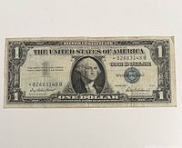 Obverse of 1957 $1 silver certificate showing star serial *82638148B and blue seal