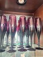 Front view of grouped purple wine glasses