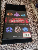 Front cover showing title, author, gemstone images, price sticker