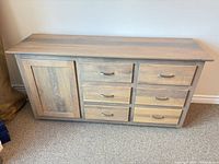 Front view showing single left door and six drawers