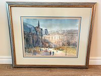 Front view of framed cityscape print with frame and mats visible