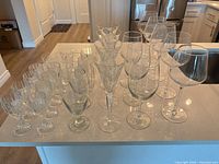 Full group of mixed stemware on countertop