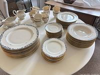 All pieces arranged on round table showing quantity and pattern