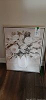 Front view of abstract floral canvas painting/print with thin black frame