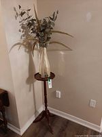 Full view of plant stand with vase and arrangement