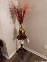 Full view of plant stand with vase and arrangement